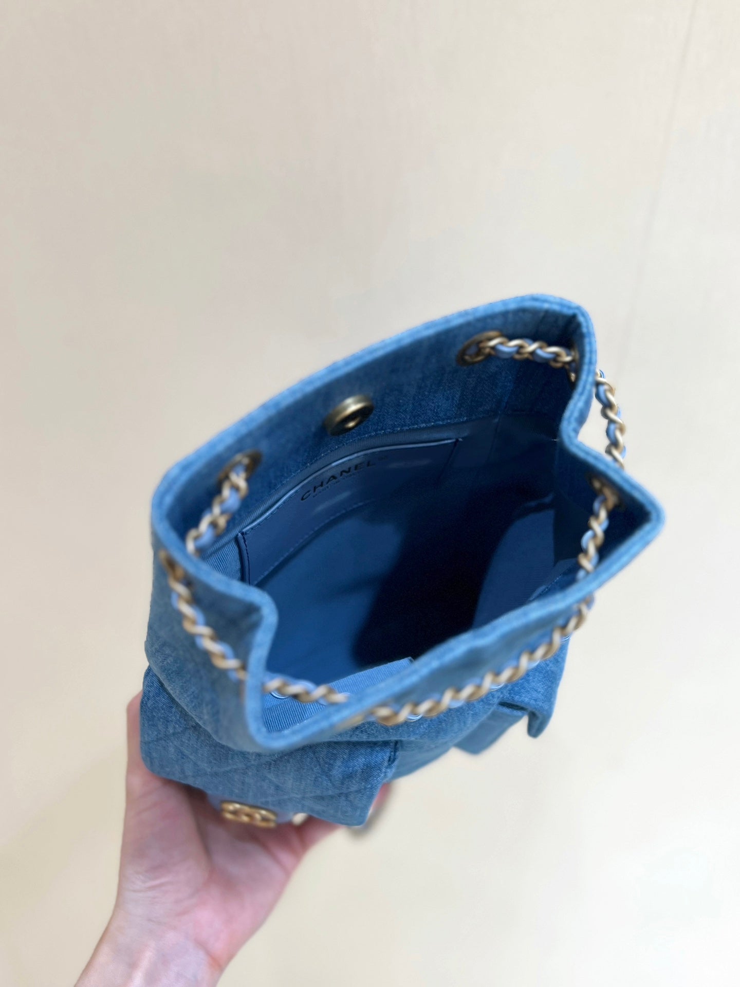 CHANEL DRAWSTRING BUCKET BACKPACK 24 IN MALIBU BLUE DENIM GOLD HARDWARE