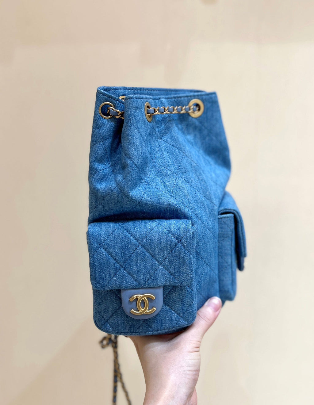 CHANEL DRAWSTRING BUCKET BACKPACK 24 IN MALIBU BLUE DENIM GOLD HARDWARE