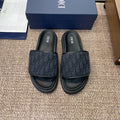 DIOR 25S ALIAS SLIDES IN BLACK CALFSKIN WITH CD OBLIQUE DARK BLUE LOGO
